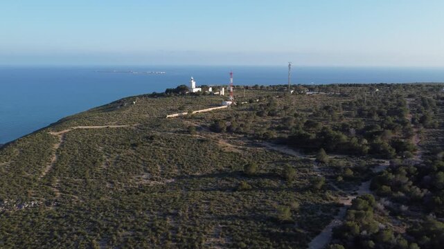 Aerial view of the Santa Pola mountain range, with the lighthouse, antennas, and Tabarca Island in the background