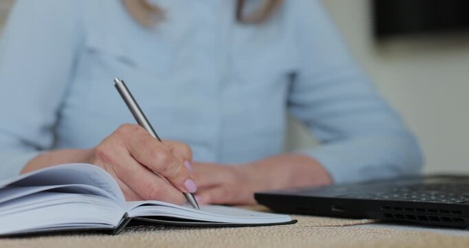 Hand and writing with senior woman in home. Contract, laptop and will with old person in retirement apartment for budget, bank finance.