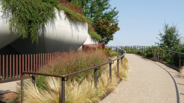 New York City Little Island pier park in Midtown of Manhattan, United States. Urban garden oasis on pillars in Chelsea, USA. Biophilic futuristic contemporary design, eco flora, plants and greenery.