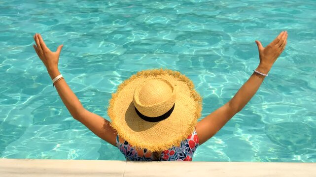 Woman in hat in swimming pool. selective focus.