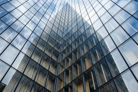 Contemporary steel atrium architecture with glass reflection where modern abstract symmetry lines and perspective shape a clean geometric space background