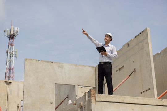 A construction manager inspects a building site