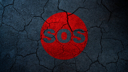 Naklejka premium An SOS distress signal within a red circle on a dark, heavily cracked asphalt surface, symbolizing crisis, disaster, and an urgent call for help or rescue