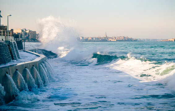 A wave breaks during the high tide at Rochebonne beach in Saint-Malo - France