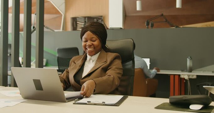Cheerful female delivers remote customer assistance using tools