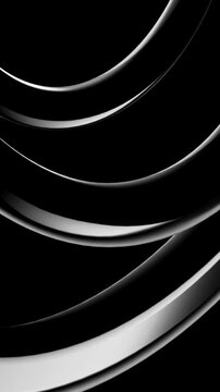 Abstract silver waves of light moving across a dark space representing fluid motion and modern architectural design concepts