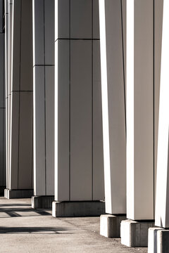 Modern architecture abstract column perspective where shadow geometry and line build a minimalism visual sequence with measured rhythm