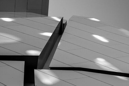Modern architecture abstract facade where white geometry line and shadow form a minimalism composition of sharp surfaces and quiet detail