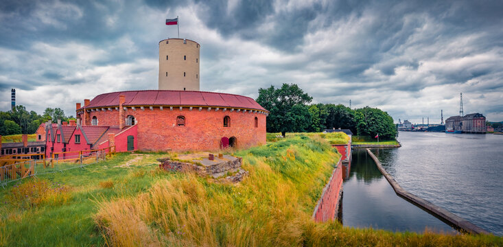 Panoramic summer view of Wisloujscie Fortress - historic fortress in Gdansk on the Martwa Wisła River, Poland, Europe. Picturesque morning cityscape of Gdansk. Traveling concept background.
