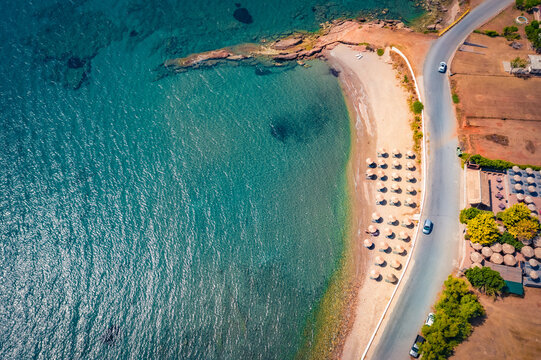 Colorful summer view from flying drone of Pyla beach, Demonia resort location. Wonderful morning seascape of Mediterranean sea. Bright outdoor scene of Peloponnese peninsula, Greece, Europe.