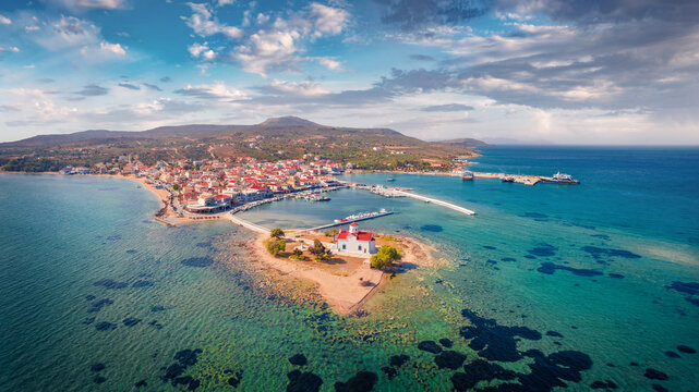 Spectacular summer cityscape of Saint Spiridon church in Elafonisos port, Greece, Europe. Magnificent morning seascape of Mediterranean Sea. Exciting outdoor scene of Elafonisos island, Greece.