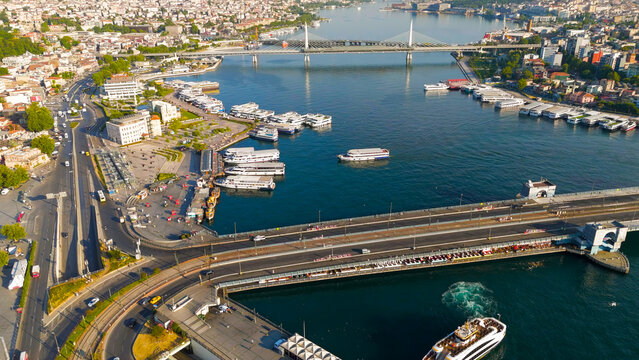 Istanbul, Turkey. Golden Horn Metro Bridge and Halic Station aerial drone view in morning sunlight. Aerial View