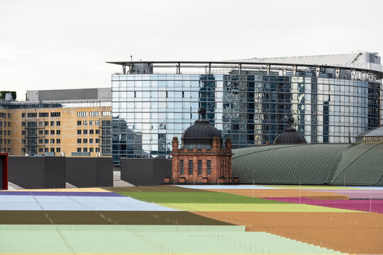 Daylight contrast in modern frankfurt city skyline where urban architecture and colorful building facade create a bold contemporary view