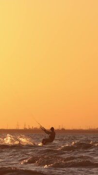 dynamic kitesurfer silhouette sunset extreme jumps and tricks slow motion power and control adrenaline sports