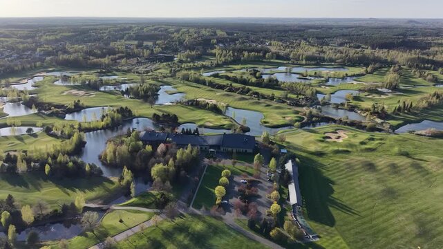 Aerial view of golf course with lakes and bunkers