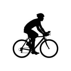 Fototapeta premium Silhouette of a person riding a bicycle in motion demonstrating active transportation and outdoor recreation