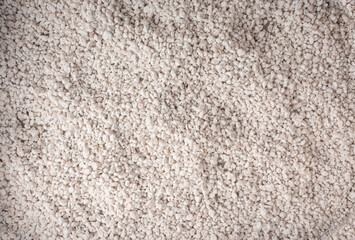 Fototapeta premium Perlite textured background, crushed amorphous volcanic glass close up