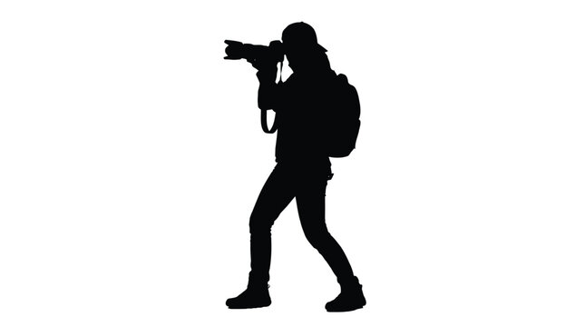 Silhouette of a creative photographer capturing high quality images using a professional digital camera lens gear