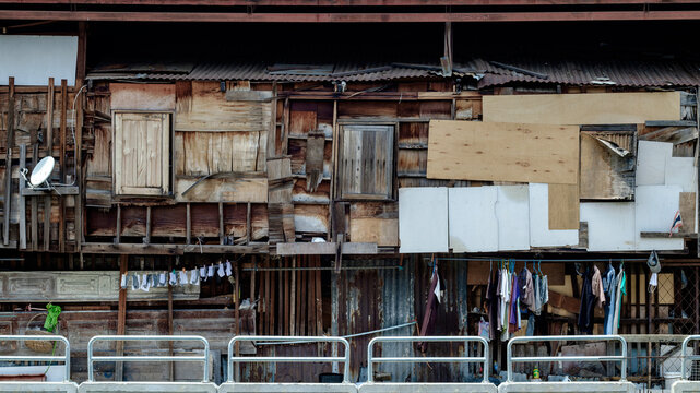 Slum Shack Wooden Wall Texture with Hanging Laundry in Thailand