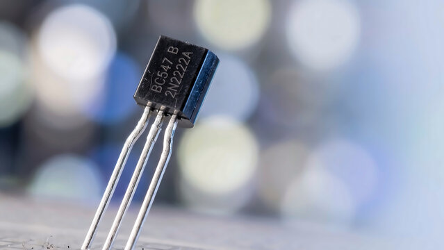 Macro of Black Bipolar Transistor on Breadboard with Soft Laboratory Bokeh