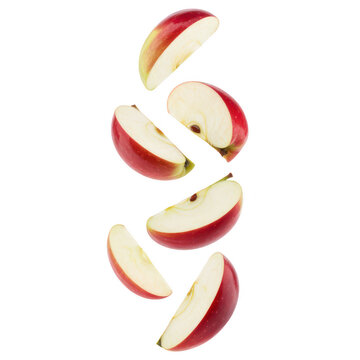 Multiple fresh red apple slices falling downwards isolated on a plain white background, for food isolated on a transparent background