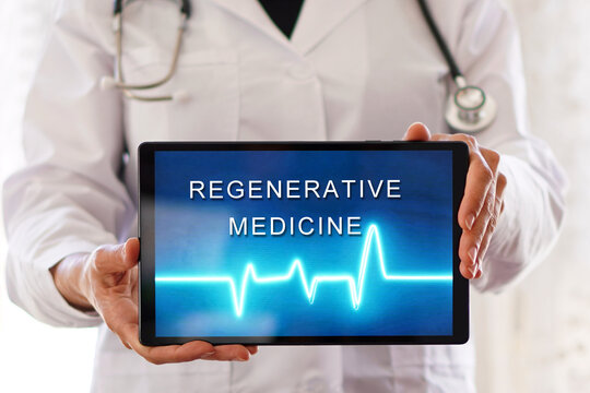 regenerative medicine. Healthcare professional showing a digital tablet. Longevity medicine concept.