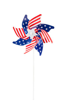 Red white and blue patriotic USA pinwheel with stars and stripes isolated on white background. American flag themed decoration and cut out design element with clipping path for Independence Day