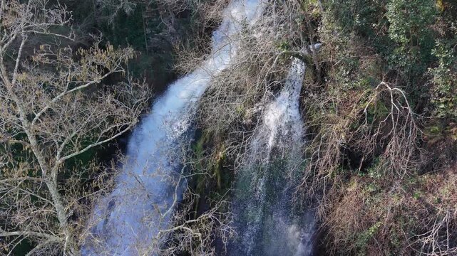 Flowing Cascades From Sheer Cliffs At Fervenza das Hortas Waterfall In Galicia, Spain. Aerial Slow Motion Shot
