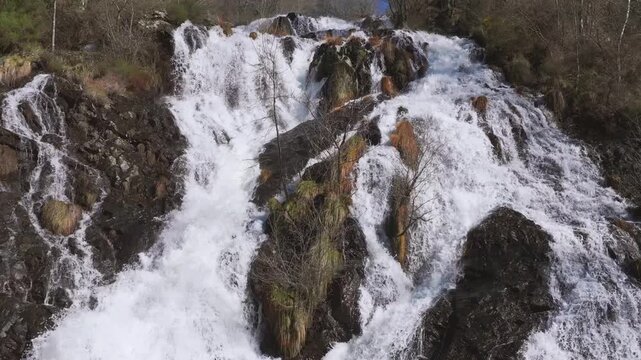 Pristine Waters Cascading Over Rocks At Furelos River In Toques, Galicia, Spain. Aerial Shot