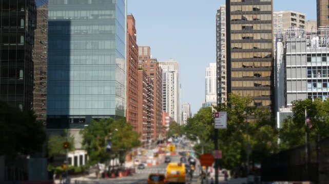 Manhattan Midtown straight street New York City, United States. Lenox Hill district York avenue, Upper East Side buildings. Urban road car traffic from Queensboro Bridge. Crossroad intersections.