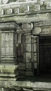 Weathered stones frame a mysterious entrance leading into the depths of an ancient temple. Echoes of history whisper through shadows cast by its weathered walls, stirring curiosity.
