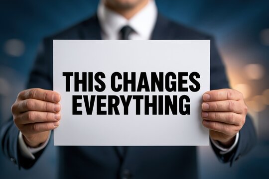 Businessman Holding a Sign Announcing a Major Change