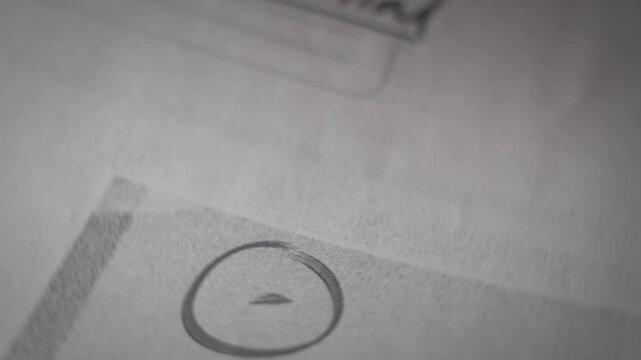 Close up on confidential classified looking government document with UFO photo. Top secret information about extraterrestrial unidentified object activity report marked confidential. Retro style file