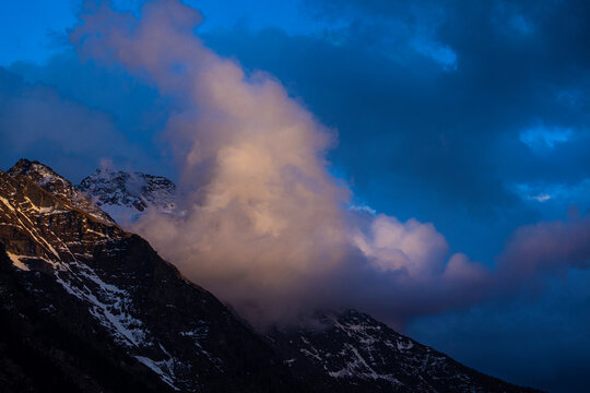 evening clouds in the european alps background
