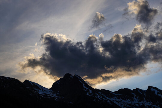 evening clouds in the european alps background
