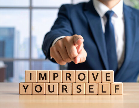 Improve Yourself - Geschäftsmann zeigt auf den Text "Improve Yourself"