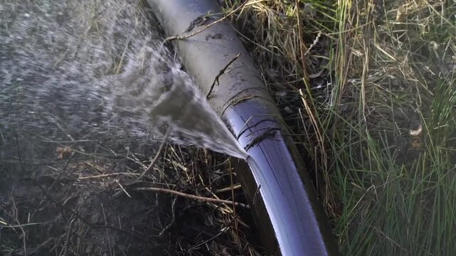 Water is spraying from a burst water pipe