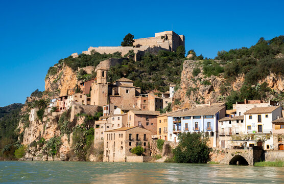 View across the Ebro River of the medieval village and castle of Miravet, Tarragona province, Catalonia, Spain