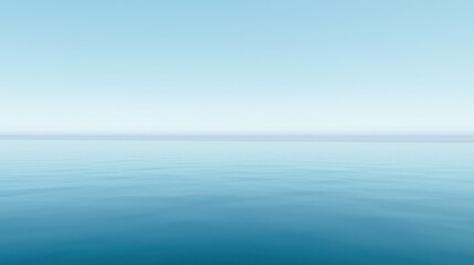 Fototapeta premium A serene seascape featuring a calm, tranquil ocean under a clear blue sky, creating a sense of peace and stillness.