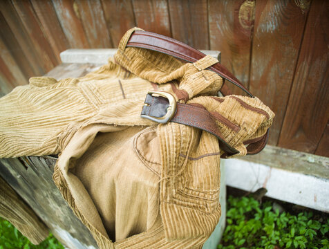 discarded old torn out velevt jeans