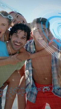 Vertical video: Friends posing for ads on beach, leaning in while blue grid sweeping over faces
