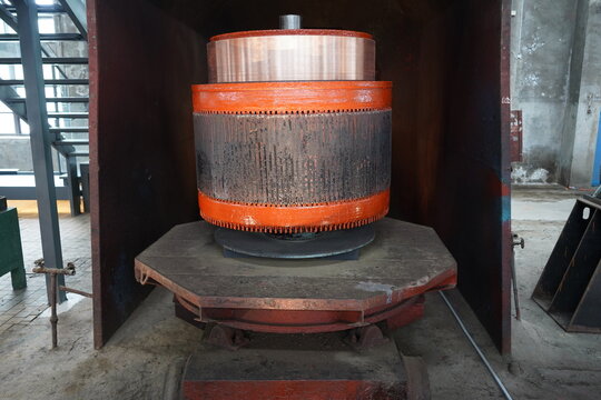 Massive electric motor armature and commutator in railway workshop