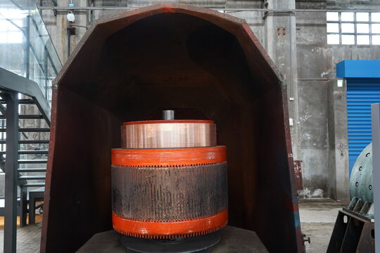 Massive electric motor armature and commutator in railway workshop