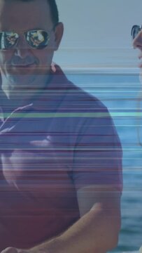 Vertical video: Man threading reel and guiding teen hands on rod for fishing at sea, glitch lines
