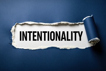 Fototapeta premium Intentionality a single word concept on a torn paper background