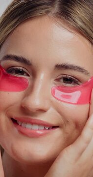Eye patch, happy and face of woman for fine line treatment, hyaluronic acid or beauty. Dark circles cosmetics, collagen mask and self care with person for dermatology, hydration and skincare glow