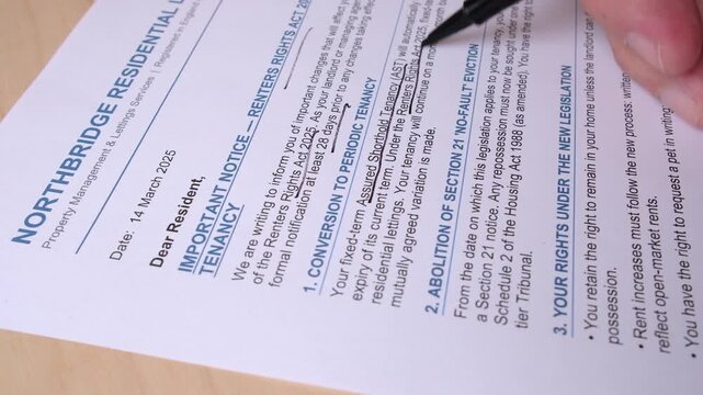 Property mgmt documentation is reviewed by manager with pen, close-up