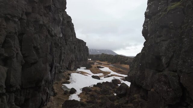 Drone view of &THORN;ingvellir National Park, showcasing rift valley, tectonic plates, and dramatic natural landscape in a historic UNESCO site.