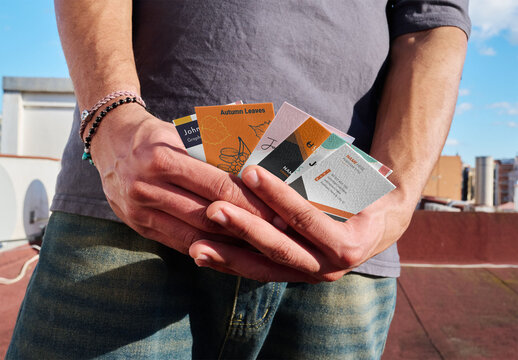 Business Cards Mockup on a Rooftop Scene With Hands