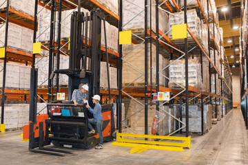 warehouse workers working with forklift loader © auremar